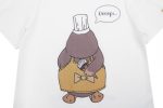 A white cotton t-shirt featuring a cartoon platypus wearing a chef's hat and apron with a speech bubble.
