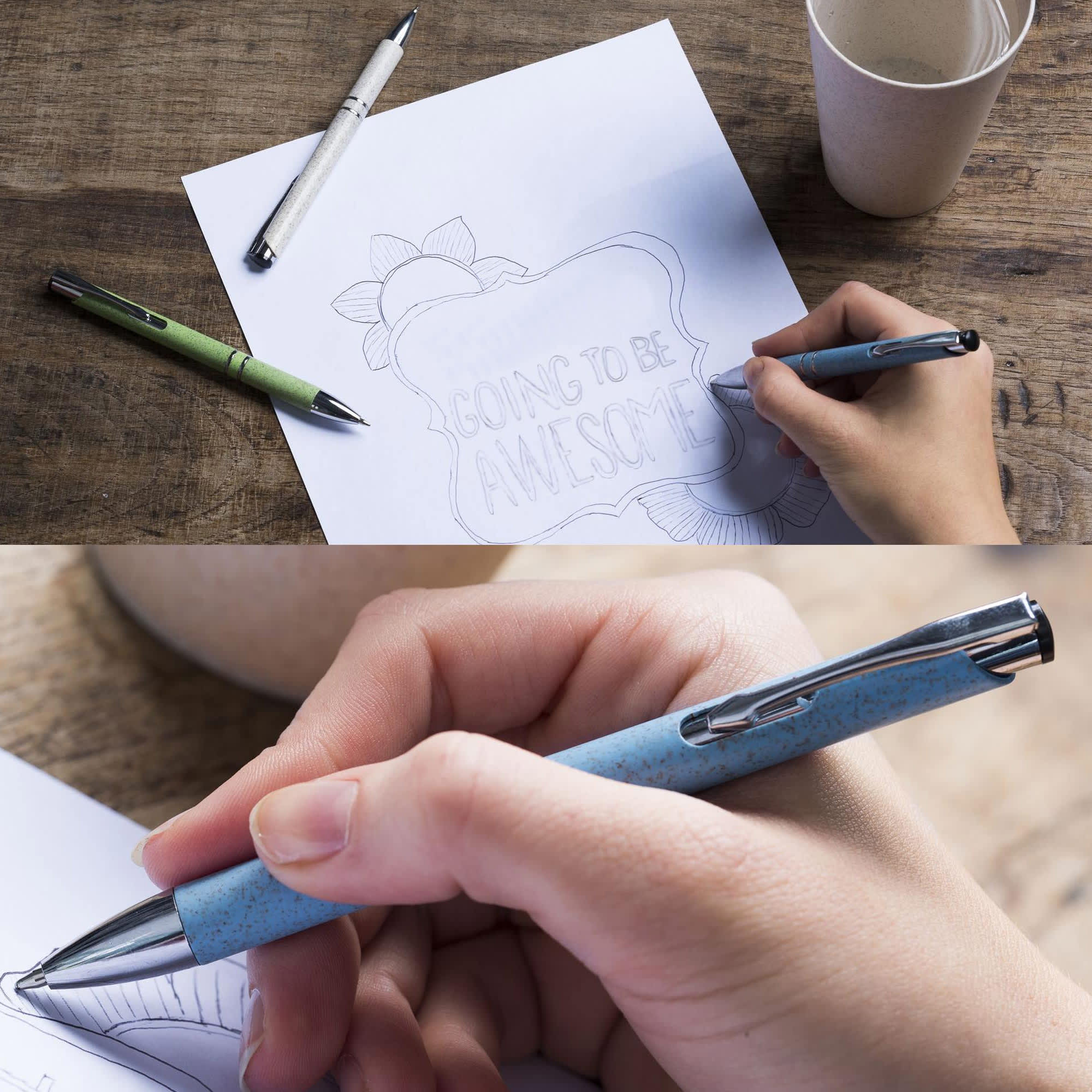 A collection of eco-friendly pens in green, blue, and white, with one held above a drawing on paper. Euroauz Eco Pen - Image 1
