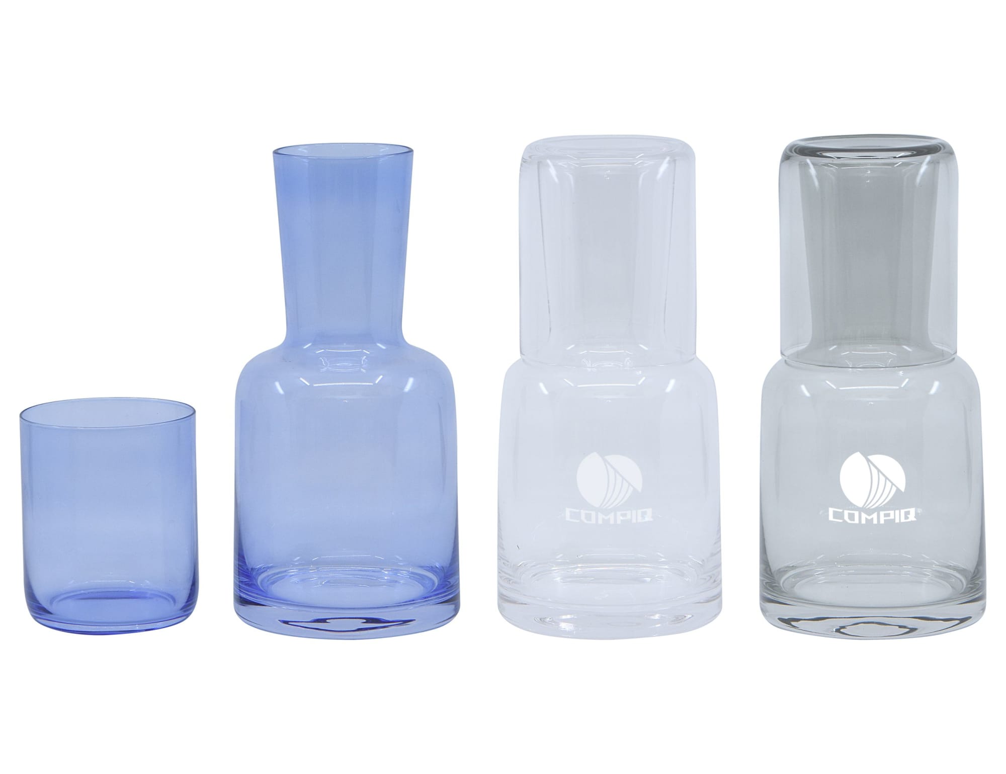 A drink bottle and tumbler set featuring two glass carafes in clear and light blue, alongside matching tumblers. Lux Carafe & Tumbler Set - Image 1