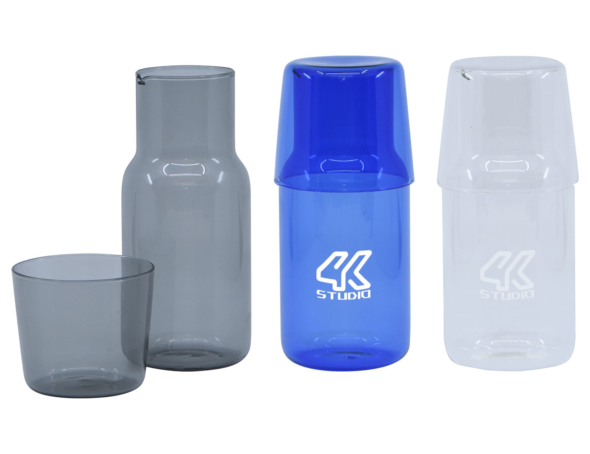 A drink bottle set featuring a clear carafe, a blue tumbler, and a grey tumbler, with a logo present. Harmony Carafe & Tumbler Set - Image 1