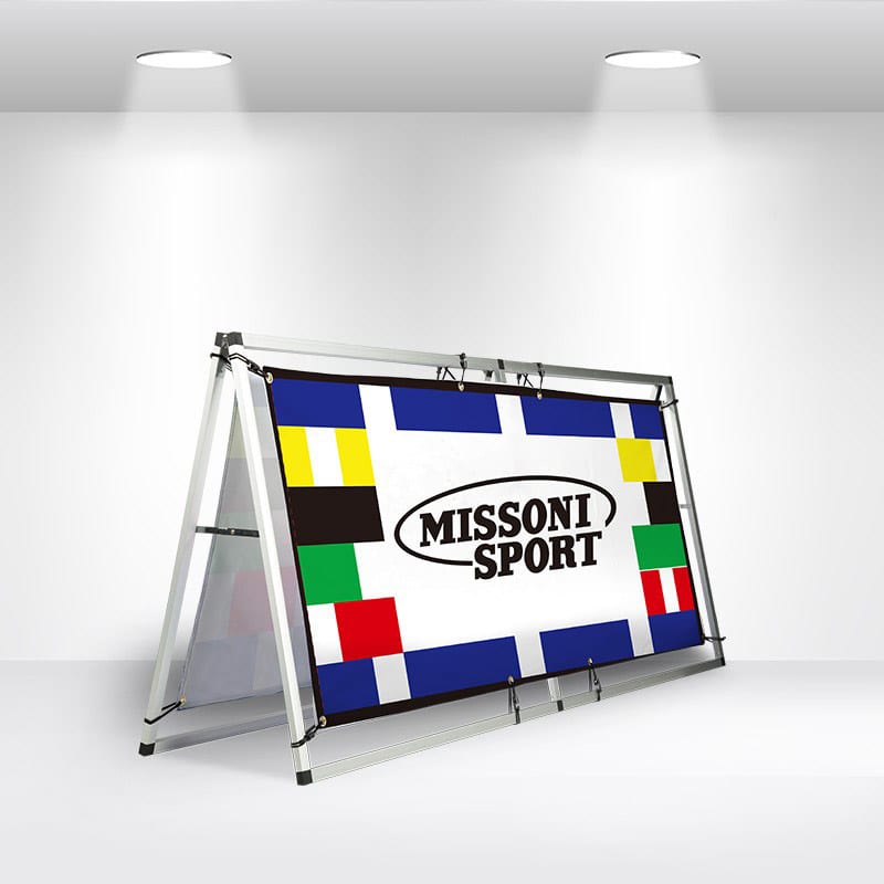 A-frame banner stand featuring a colourful design with a branded logo, set in a well-lit exhibition space. A-Frame Banner Stand - Image 1