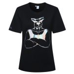 A black cotton t-shirt with a shiny, reflective graphic design featuring a muscular figure. The shirt has a logo on the sleeve.
