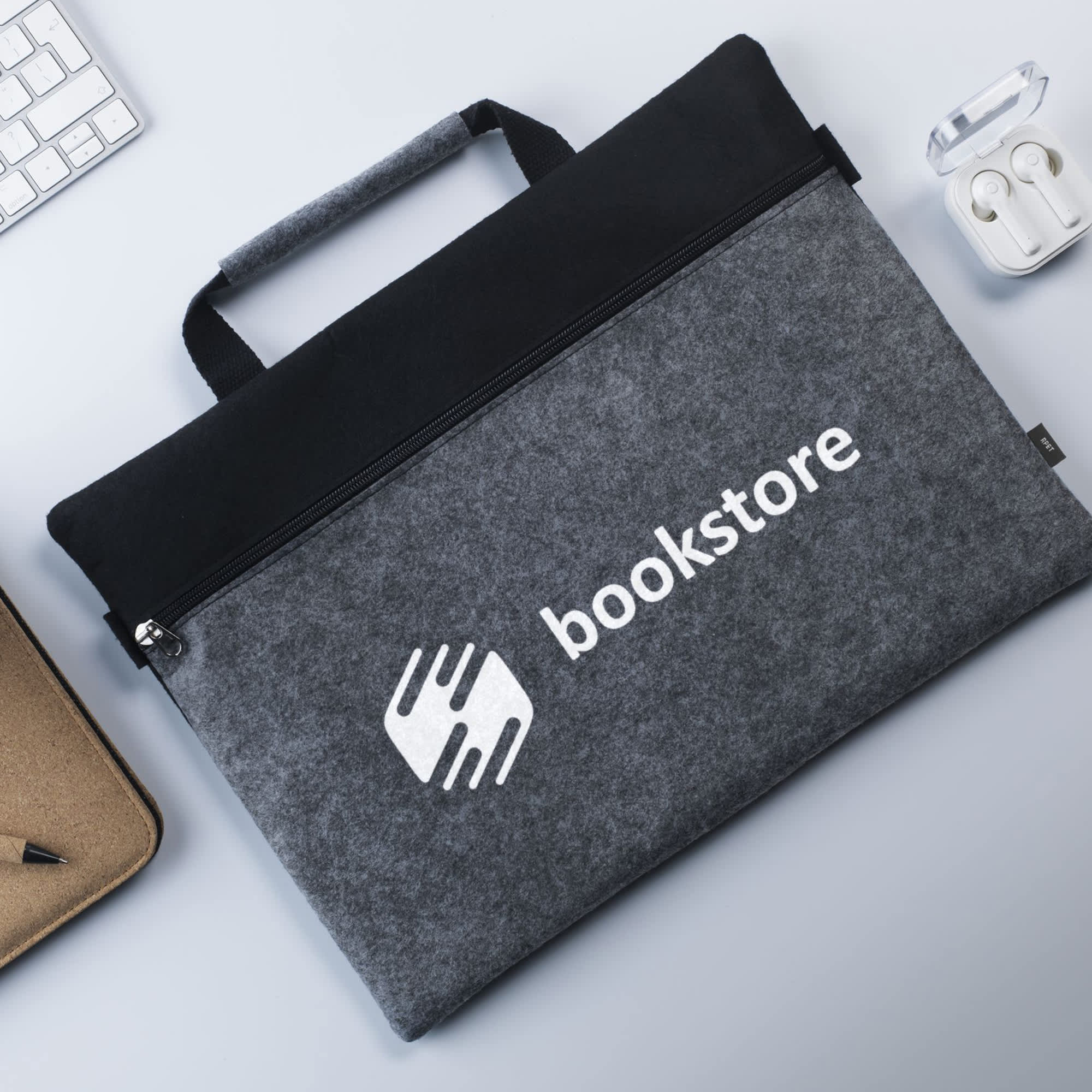 A grey felt carry case with a black top and a logo, featuring a zip closure and a handle. Captian Felt Carry Case - Image 1