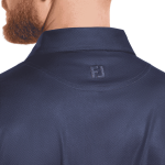 A navy blue polo shirt featuring a subtle dot print and a logo on the back collar.