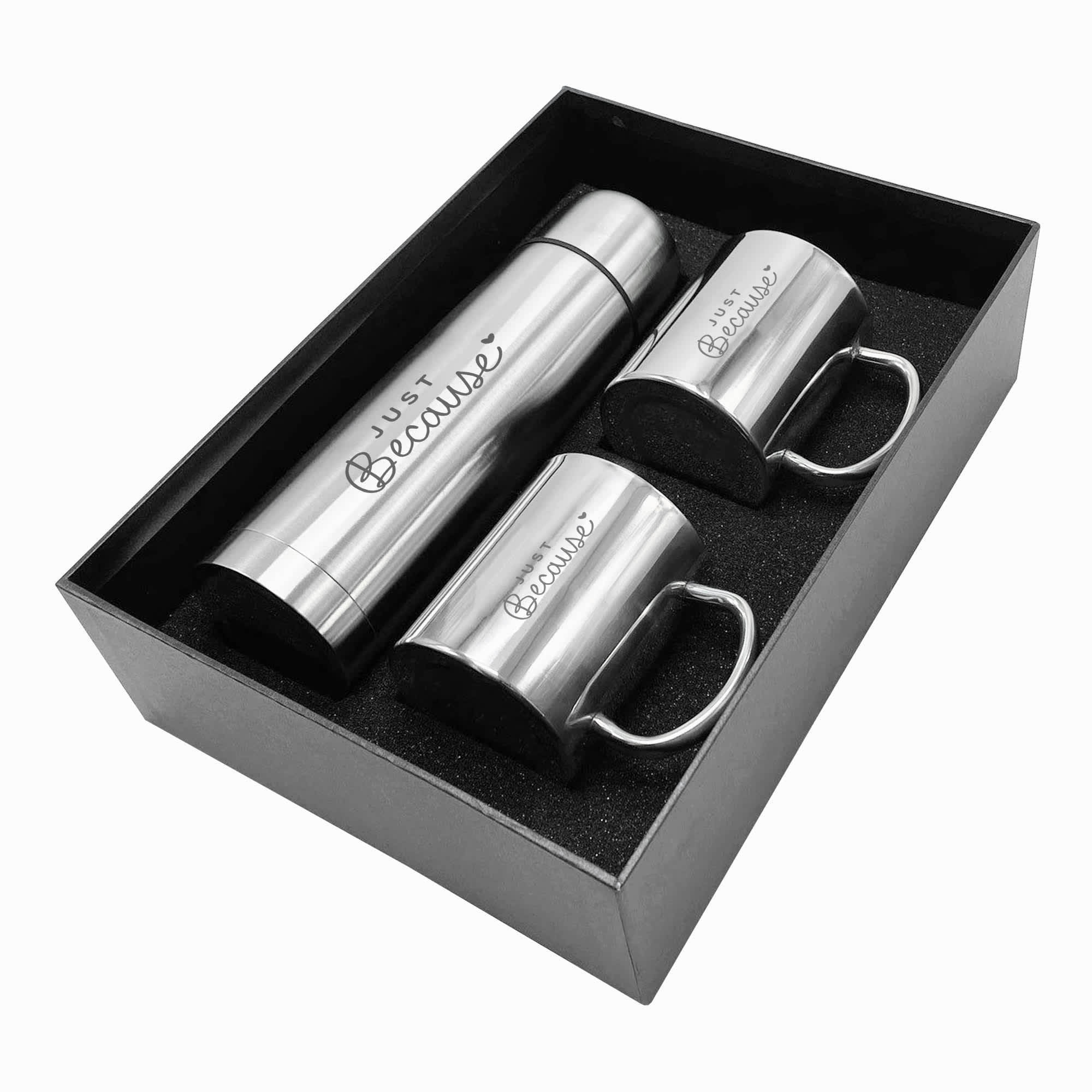 A drink bottle and two matching mugs in a sleek black gift box. The items are silver in colour and feature a logo. Bella Gift Set - Image 1