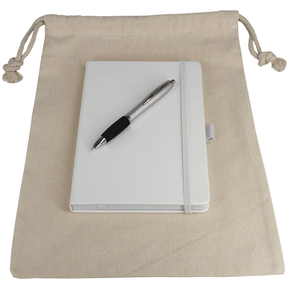 A cream drawstring bag containing a white journal book and a silver pen. The bag has a branding logo. Gift Set - Drawstring Bag + JournalBook + Pen - Image 1