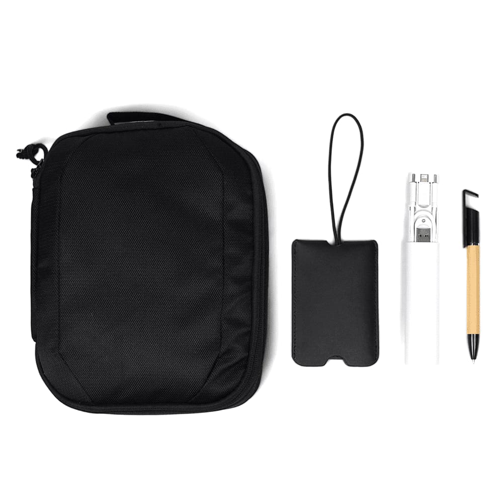 A black travel pack with a drink bottle, a pen, a cardholder, and a small strap accessory. Travel Pack - Image 1