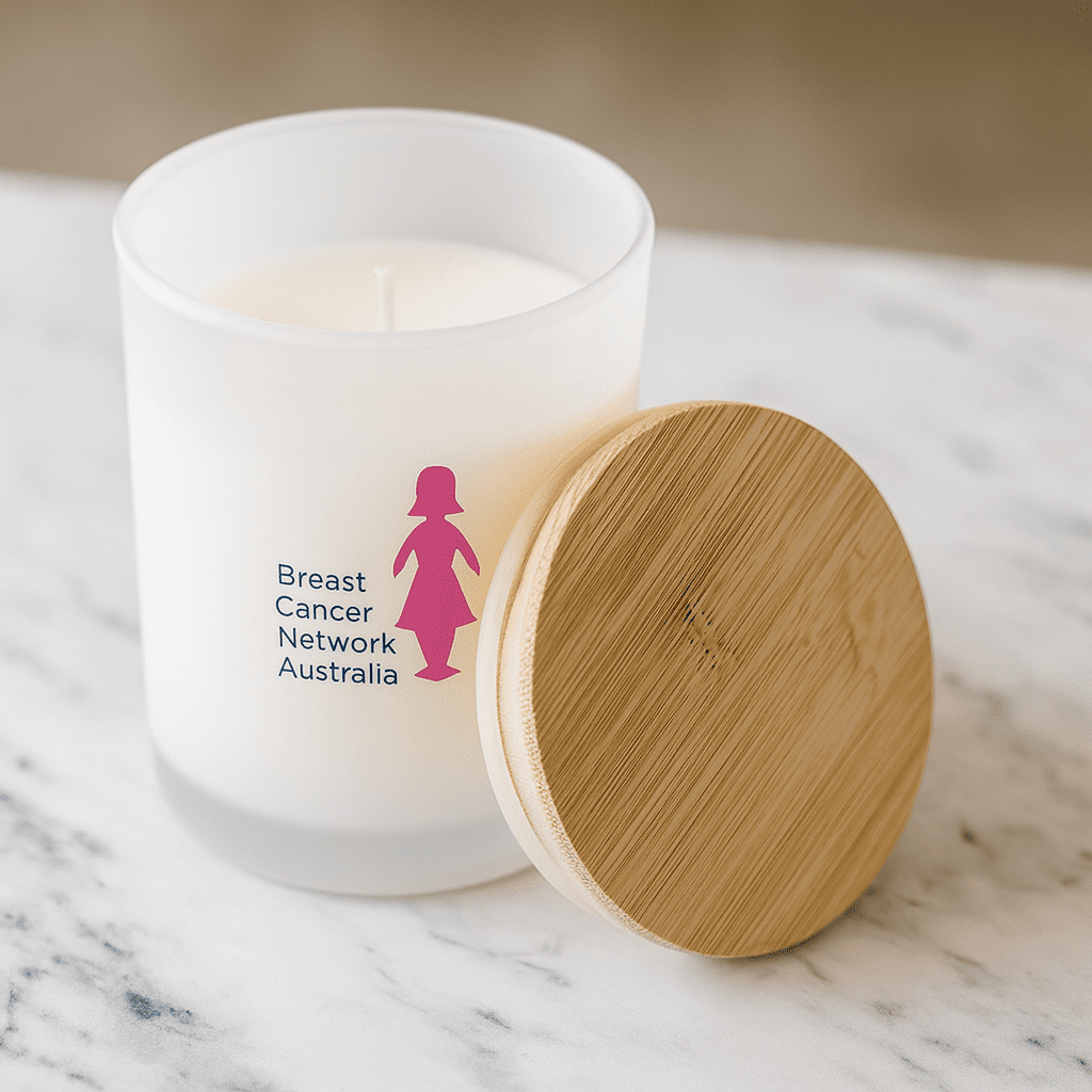 A medium white candle with a bamboo lid and a logo on the frosted glass, set on a marble surface. Relax Candle - Medium - Image 1