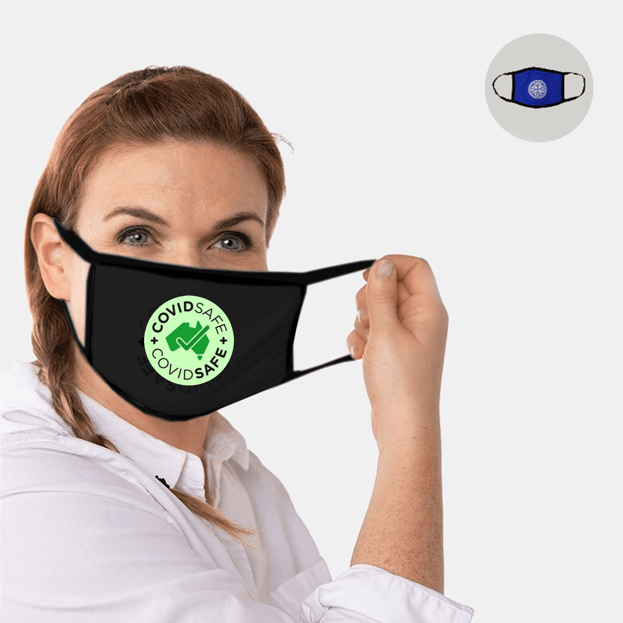 A woman holding a black cotton face mask featuring a green circular logo. Another blue mask is displayed in the corner. Cotton Face Masks - Image 1