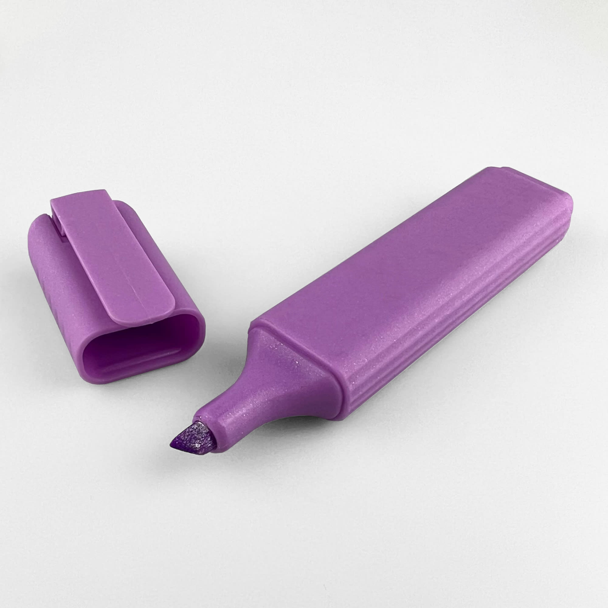A purple highlighter with a chisel tip, accompanied by its matching cap. Sculpt Highlighter - Image 1