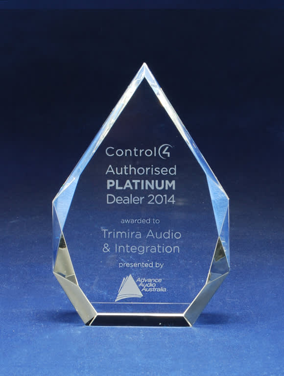 A crystal award in a diamond shape, featuring a logo and engraved text on a blue background. Infiniti Crystal Arrow - Image 1
