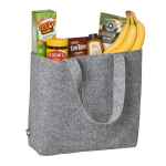 A grey felt shopper bag containing bananas, Tim Tams, Vegemite, Shapes, and sea salt. The bag has sturdy handles and a logo.