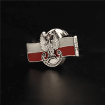 A custom enamel lapel pin featuring a design with red and white colours and a winged emblem.
