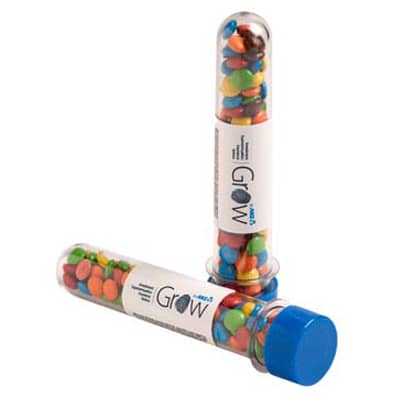 A promotional test tube filled with colourful M&Ms, featuring a blue cap and a branding label. Test Tube with Mini M&Ms 40g - Image 1