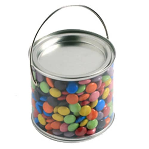 A medium, clear PVC bucket filled with colourful choc beans, featuring a metallic handle. Medium PVC Bucket with Choc Beans 400g - Image 1