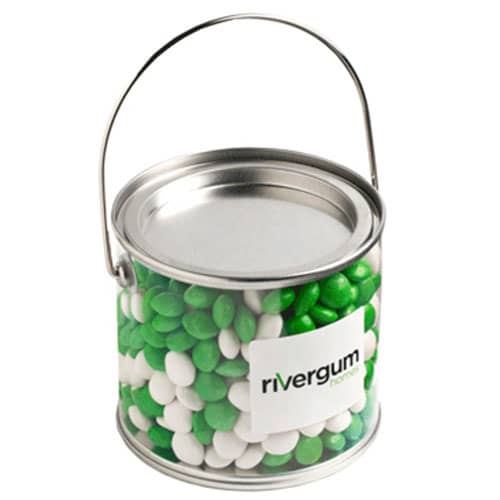 A medium PVC bucket filled with green and white chewy fruits, featuring a handle and a logo on the side. Medium PVC Bucket with Chewy Fruits 400g - Image 1