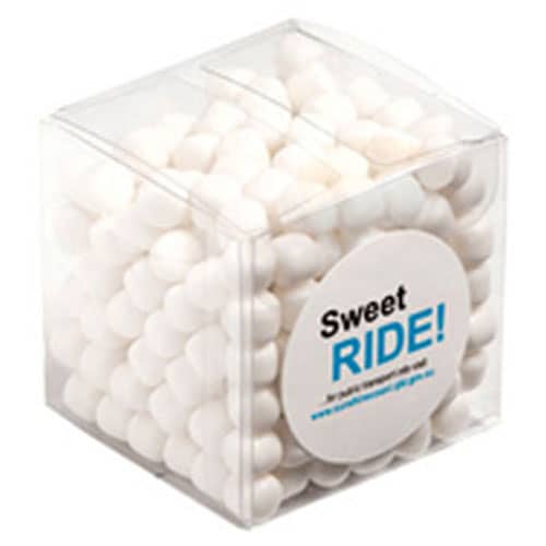 A clear cube filled with white chewy mints, featuring a circular logo. Cube with Chewy Mints 110g - Image 1