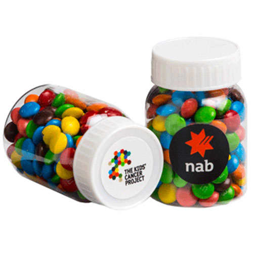 Two clear jars filled with colourful mini M&Ms, featuring a white lid and logos on one side. Baby Jar with Mini M&Ms 45g - Image 1