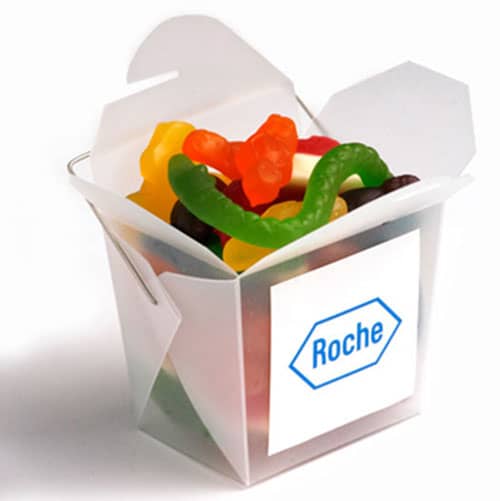 A frosted noodle box filled with mixed lollies in bright colours, including gummy bears and sour worms. A frosted noodle box filled with mixed lollies in bright colours, including gummy bears and sour worms.
