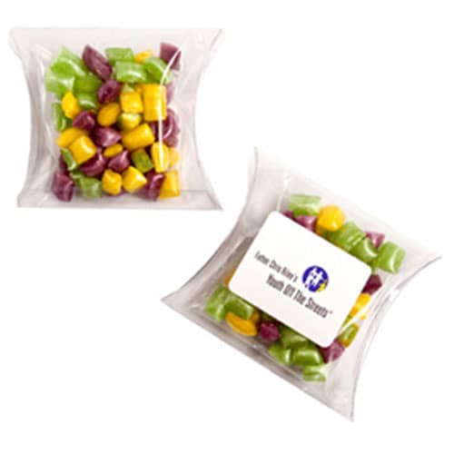 A clear pillow pack containing colourful humbugs in purple, green, and yellow shades. The pack features a logo. Pillow Pack with Humbugs 50g - Image 1