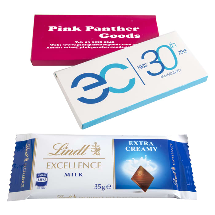 A printed box featuring a Lindt 35g chocolate bar in a blue and gold wrapper, alongside two other promotional boxes. Printed Box with Lindt Bar 35g - Image 1