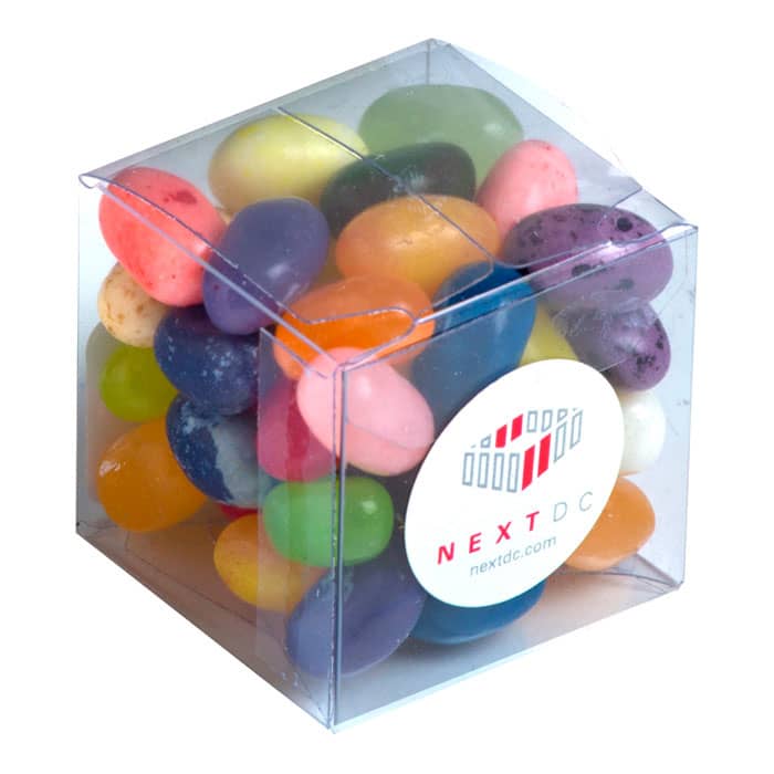 A clear cube filled with colourful jelly beans in various flavours, featuring a logo on the front. Cube with JELLY BELLY Jelly Beans 60g - Image 1