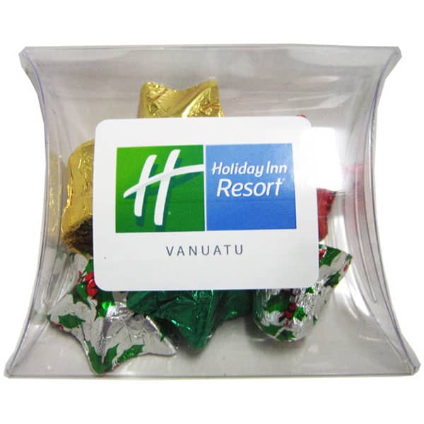 A clear pillow pack containing assorted Christmas chocolates wrapped in festive gold, red, green, and silver foil. Pillow Pack filled with Christmas Chocolates 45g - Image 1