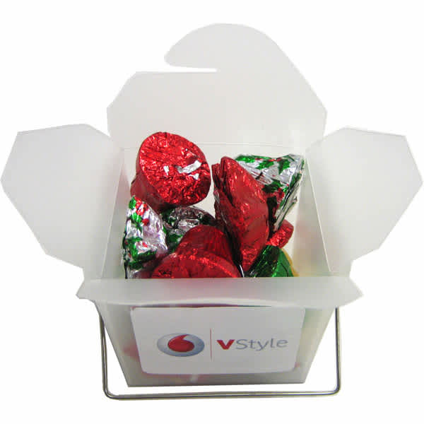 A frosted noodle box filled with red and green Christmas chocolates, featuring a branded logo on the side. Frosted Noodle Box with Christmas Chocolates 85g - Image 1