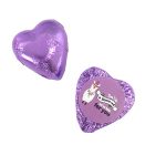 A purple chocolate heart wrapped in foil with a playful label featuring a llama.