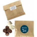 A kraft paper bag containing Lindt buttons and marshmallows, with a logo on the front.