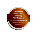 A glass jar of Australian honey with a brown and gold label, featuring a logo and recyclable details.