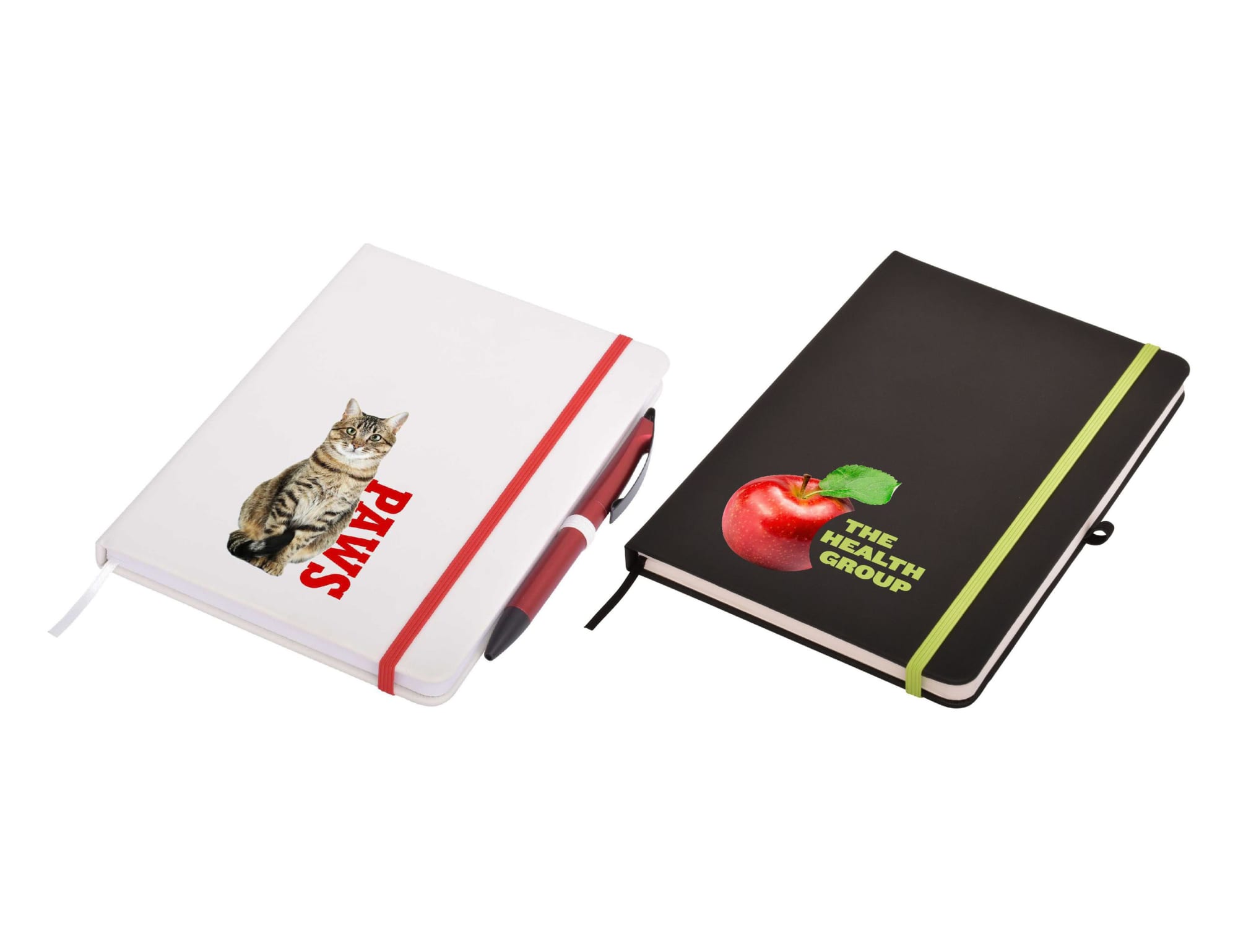A white notepad with a cat graphic and a black notepad with an apple graphic, both featuring elastic bands. Carnival Plus A5 Notepad - Image 1
