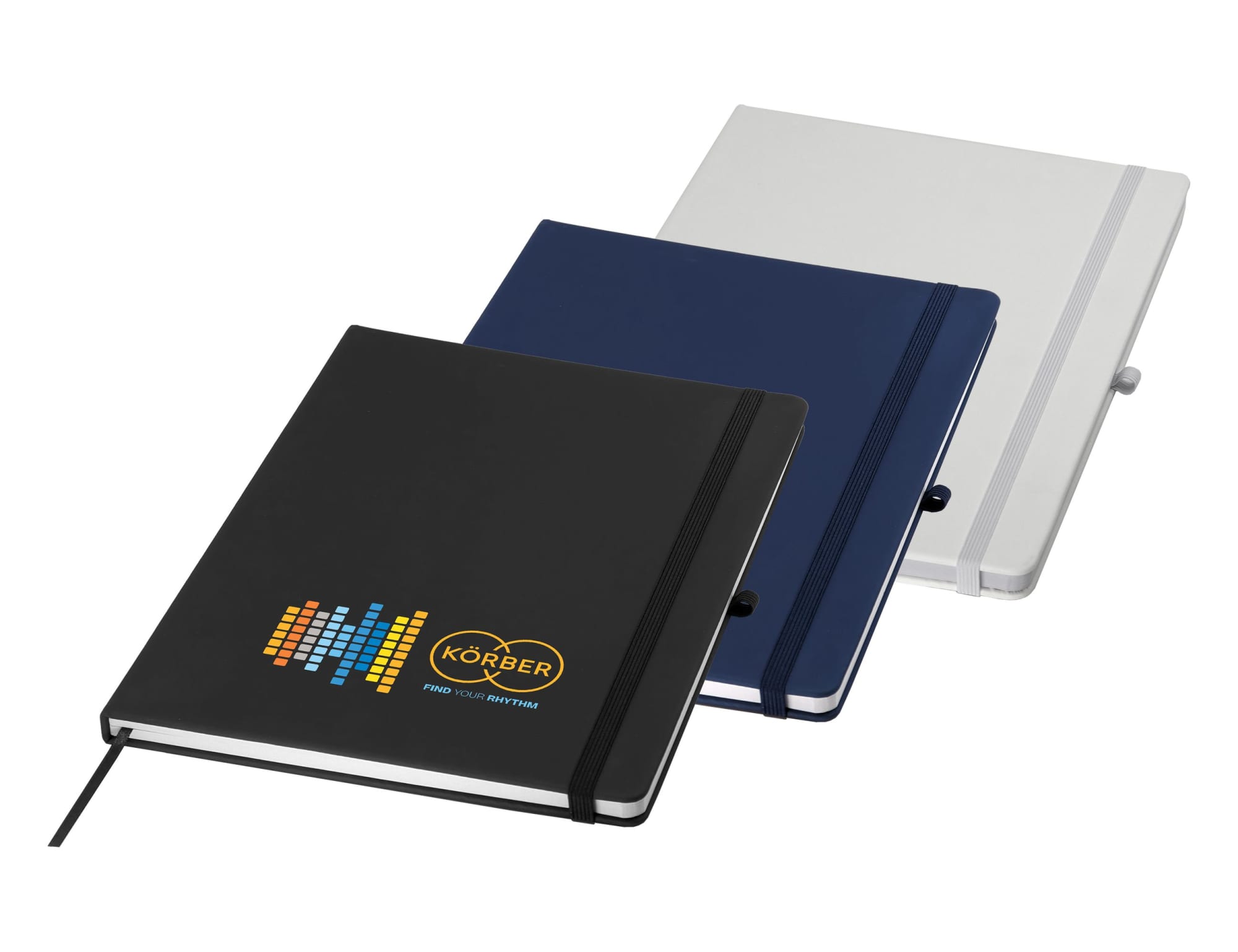 A set of three A4 notebooks in black, navy blue, and grey, each featuring an elastic closure and a logo. Carnival A4 Notebook - Image 1