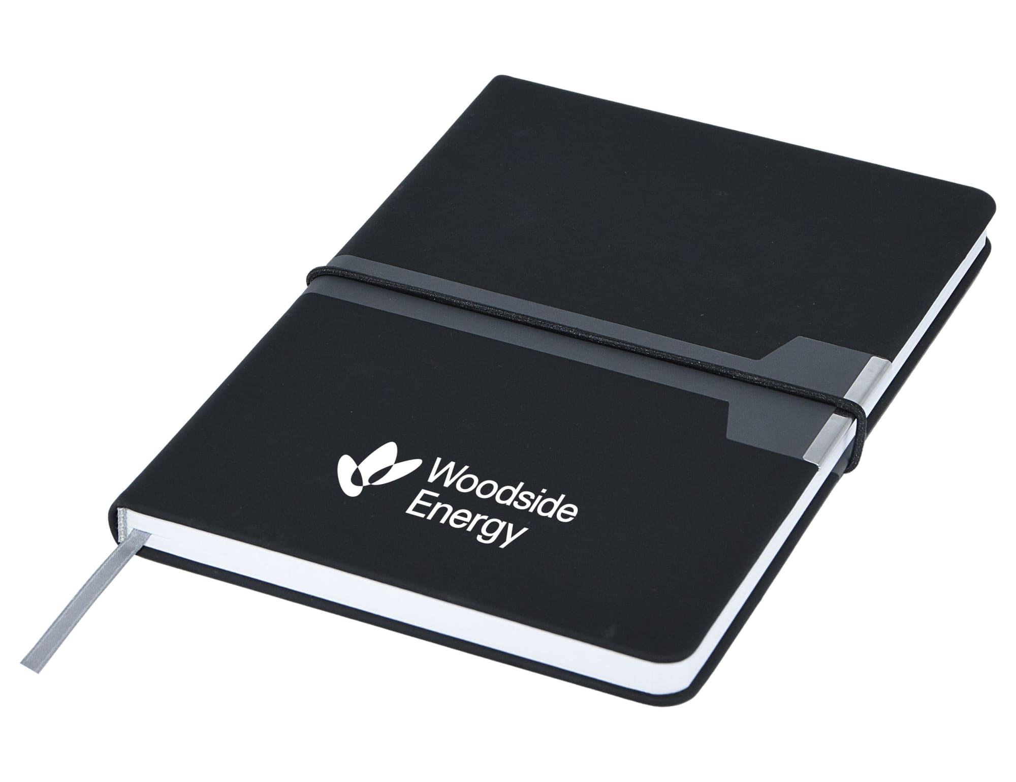 A black A5 notebook with a secure elastic band and a grey tab, featuring a logo on the cover. Vogue A5 Notebook, Black - Image 1
