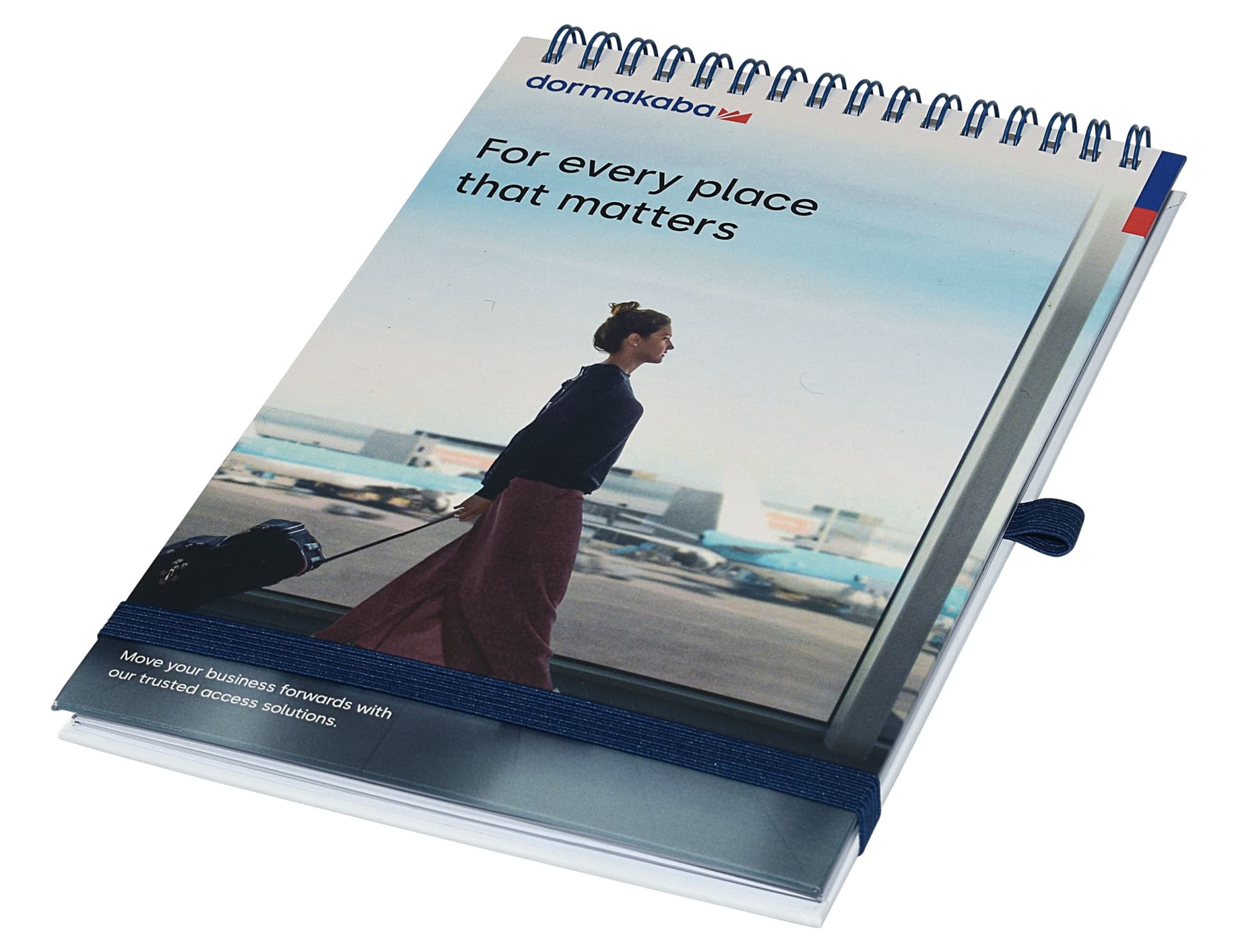 A top-bound A5 notebook with a spiral binding, featuring a blue and white cover design and a logo. Designa Wiro A5 Top Bound Notebook - Air Freight - Image 1