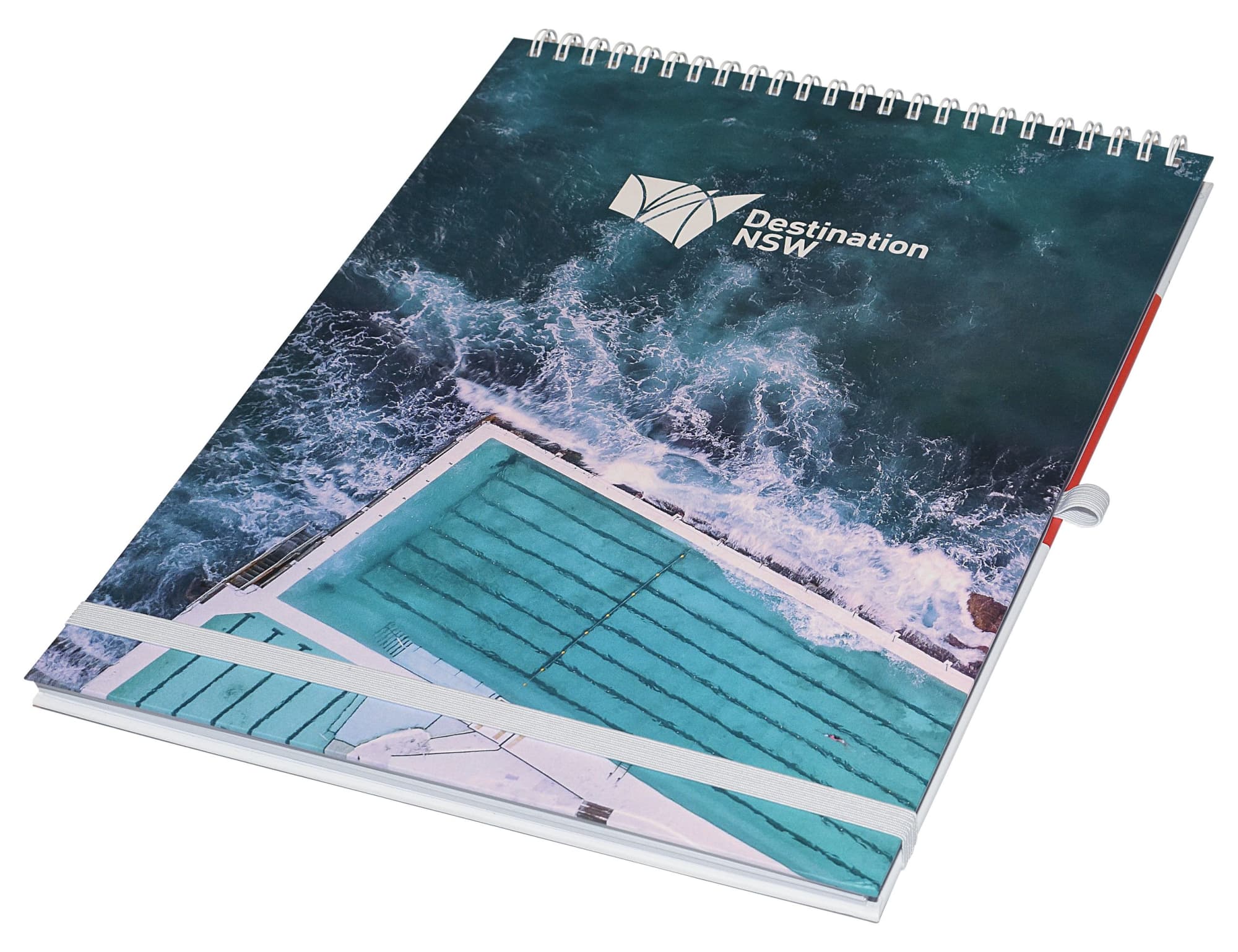 A top-bound A4 notebook featuring a water-themed design in shades of blue and white, with a logo on the cover. Designa Wiro A4 Top Bound Notebook - Air Freight - Image 1