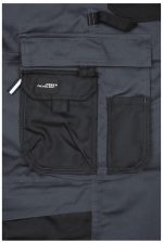 A close-up of dark grey workwear pants featuring a black bib and multiple front pockets, including a logo.