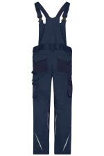 Navy workwear pants with bib, featuring multiple pockets and adjustable straps. Includes reflective detailing and a logo.
