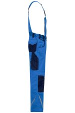 Workwear pants with bib in blue, featuring navy patches and adjustable straps. Includes pockets for utility.