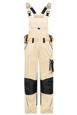 Beige workwear pants with black accents, featuring adjustable bib straps and multiple pockets. Includes a logo.