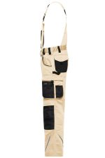 Workwear pants with bib in light beige, featuring multiple pockets and black trims. Includes adjustable straps and branding.