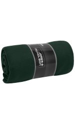 A rolled dark green fleece blanket wrapped with a label featuring a logo.