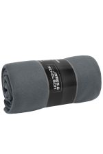 A rolled grey fleece blanket with a label featuring a logo, showcasing soft, textured fabric.