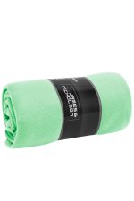 A rolled fleece blanket in bright green with a black branding label around it.