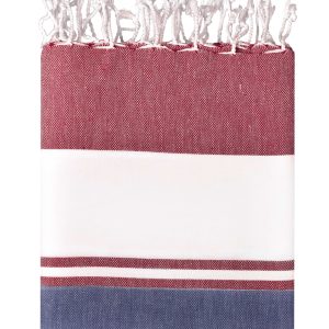 A beach blanket in maroon, white, and navy stripes with a fringed edge and a logo.