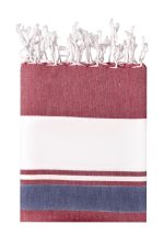A striped beach blanket in burgundy, white, and navy, featuring fringed edges and a logo.