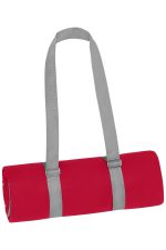A rolled red picnic blanket secured with grey straps, featuring a simple design and no visible branding.
