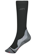A pair of black and grey compression socks with a logo, featuring a distinctive design and knee-length fit.