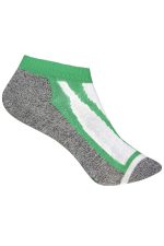 A pair of low-cut socks featuring a grey base with green and white accents and a logo.