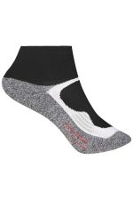 A pair of short sport socks featuring a black upper and grey textured design, with a logo on the side.